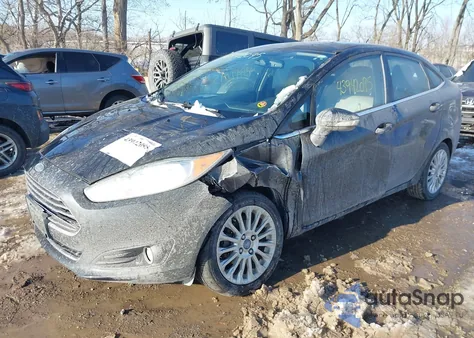 2014 Ford Fiesta Titanium z USA, uszkodzony, nr VIN 3FADP4CJ4EM107071